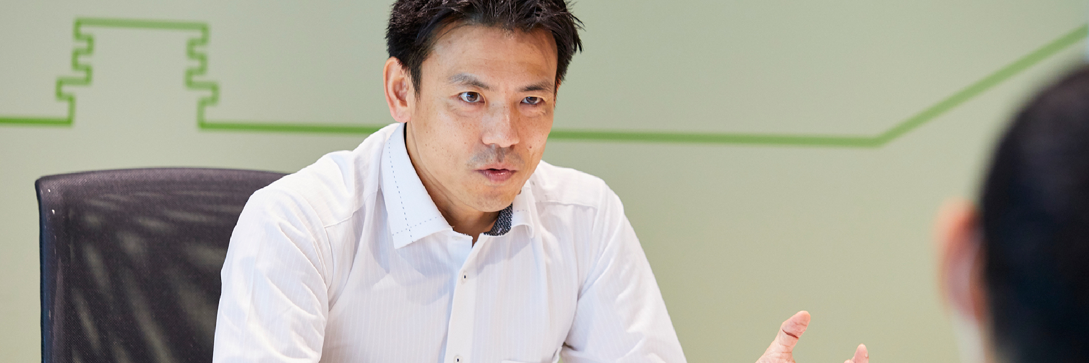 市川さんが取り組んでいる技術について説明している写真